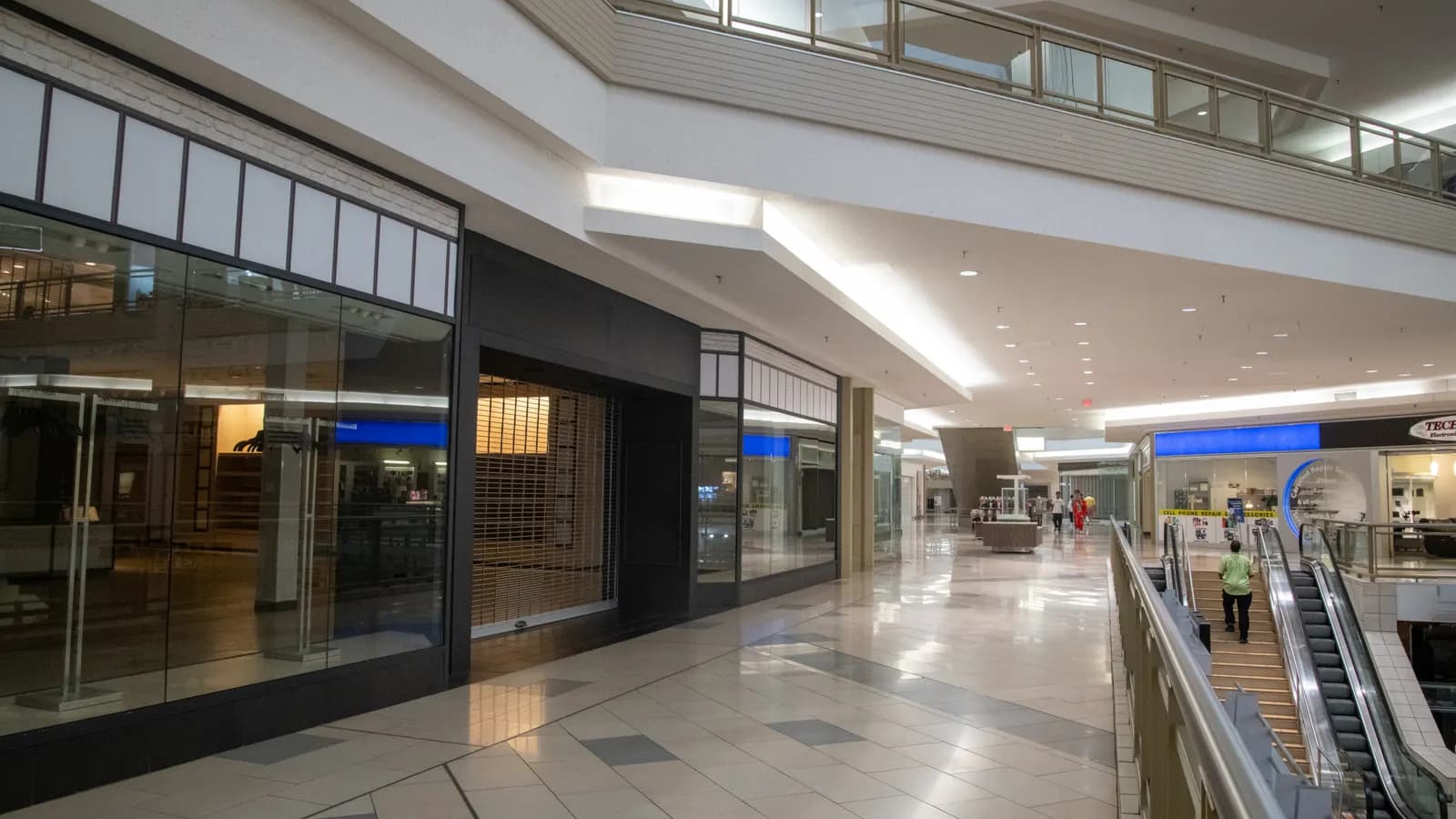 Shoppers on the upper concourse of a multi-level shopping centre